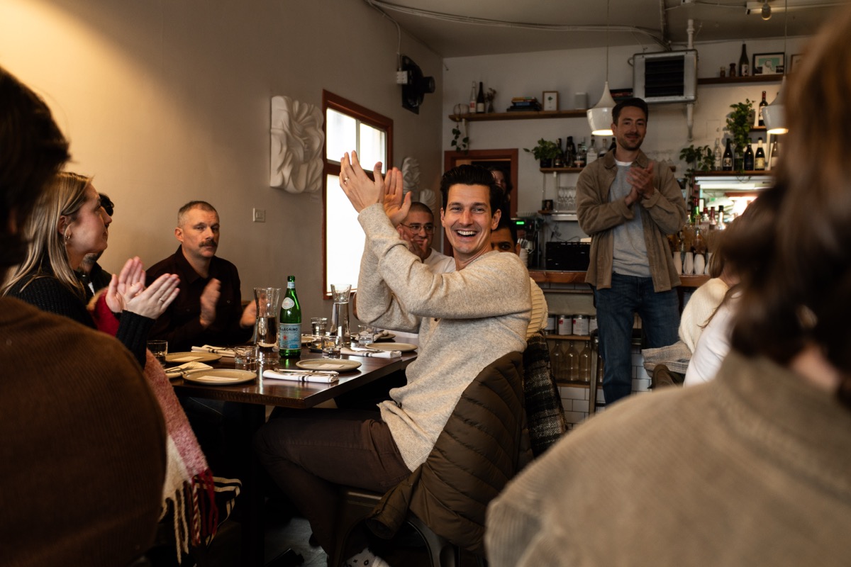 The room applauding a member's win